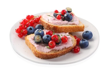 Photo of Tasty sandwiches with cream cheese, blueberries and red currants isolated on white