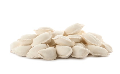 Photo of Heap of raw dumplings on white background