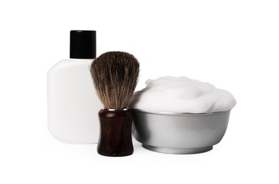 Photo of Shaving brush, foam and lotion on white background