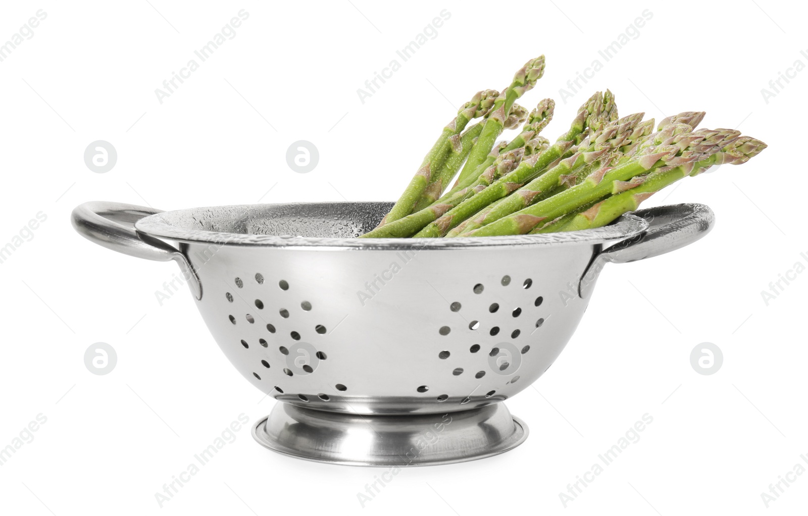 Photo of Metal colander with asparagus isolated on white