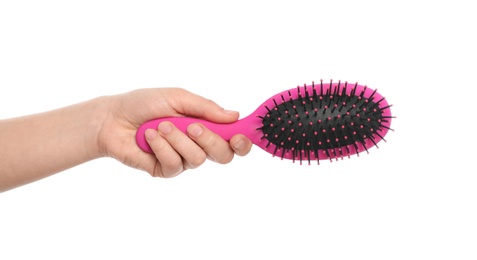 Photo of Woman holding hair brush on white background, closeup