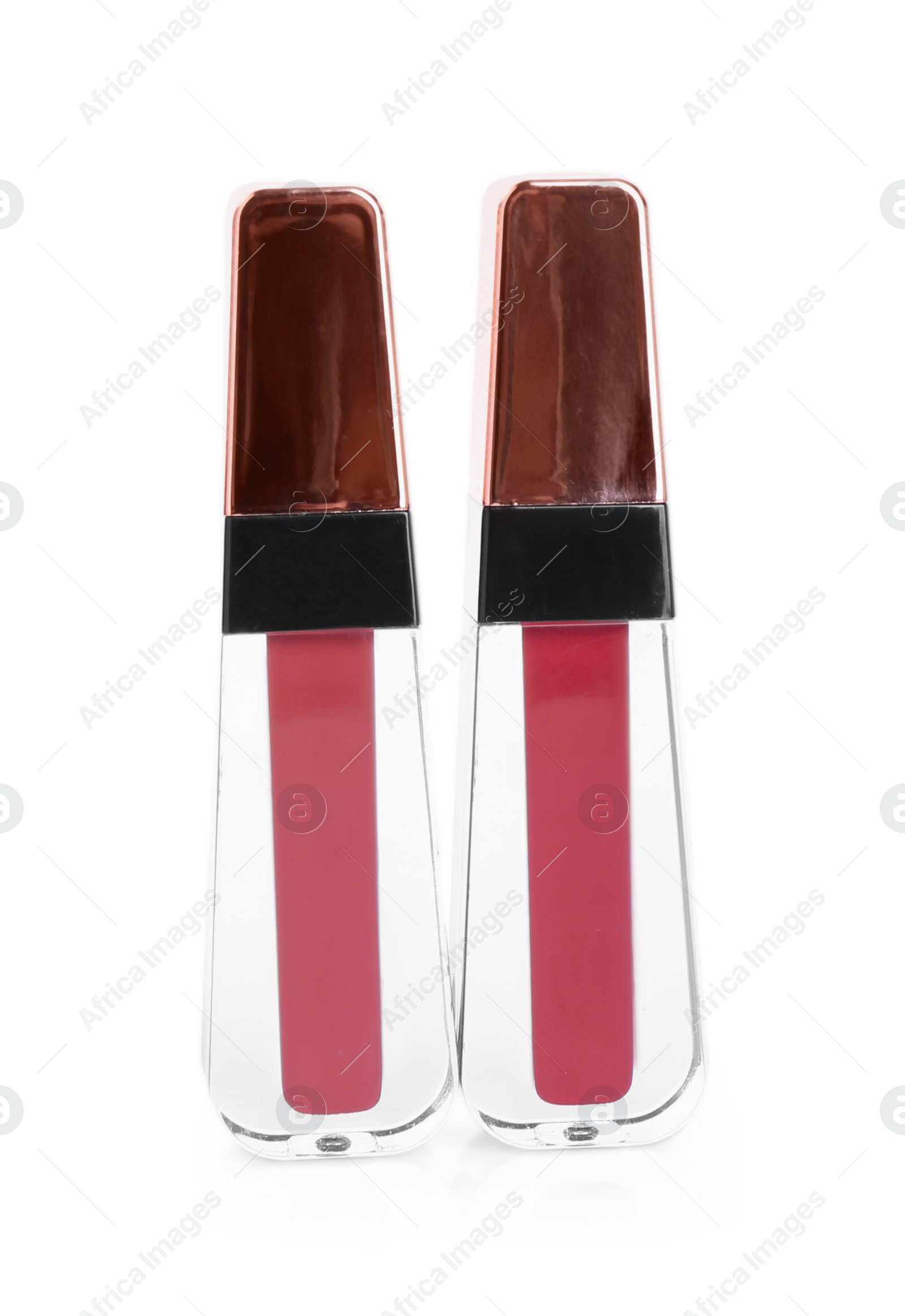 Photo of Two lip glosses isolated on white. Cosmetic products