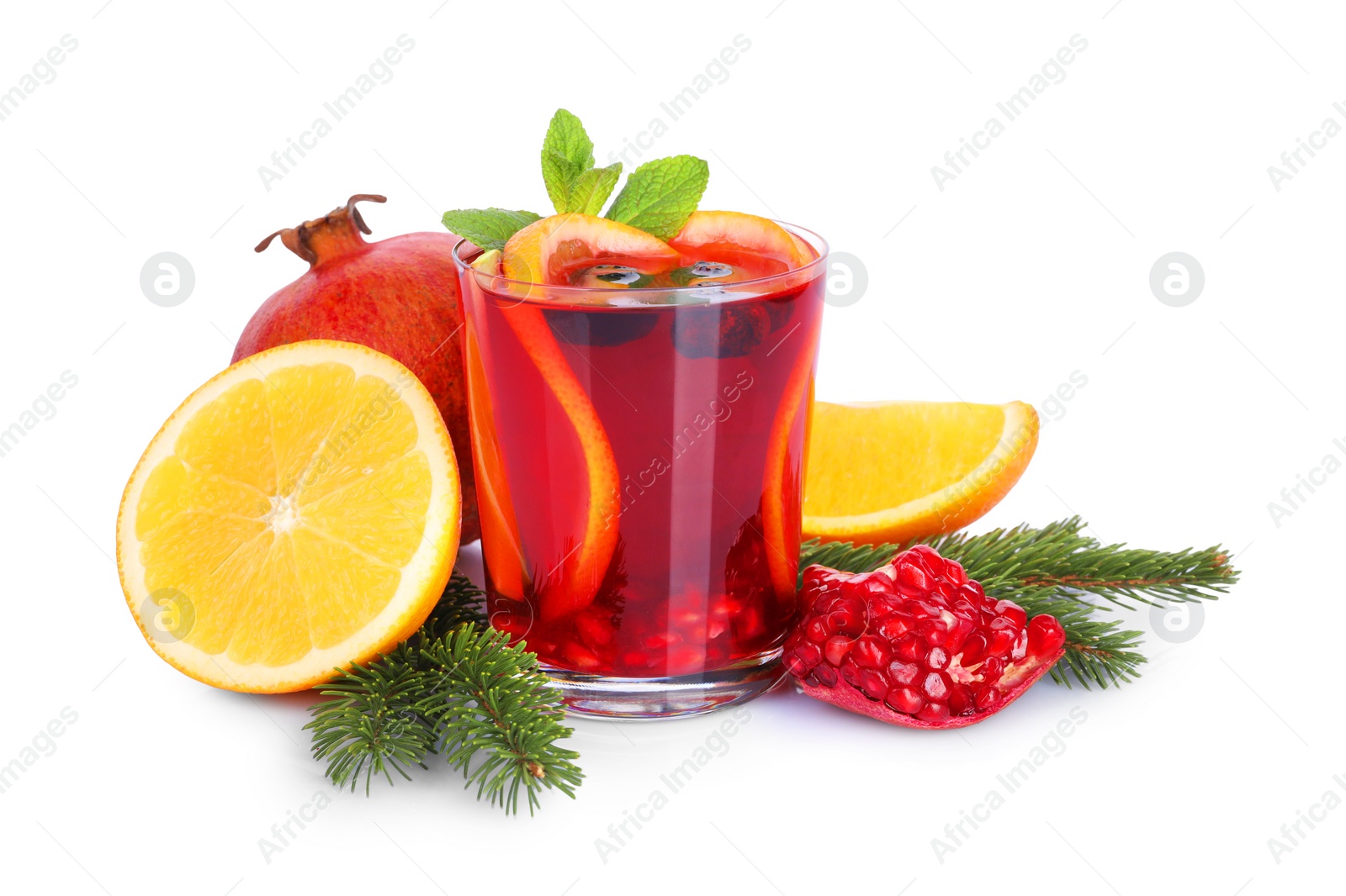 Photo of Aromatic Christmas Sangria drink in glass, fir branches and ingredients isolated on white