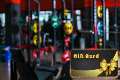 Gym gift card. Blurred view of health club with modern equipment