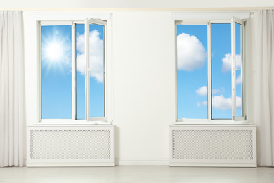 Image of Beautiful view on blue sky with clouds through windows in room