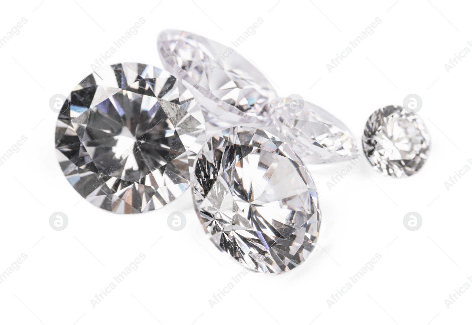 Photo of Many beautiful shiny diamonds isolated on white