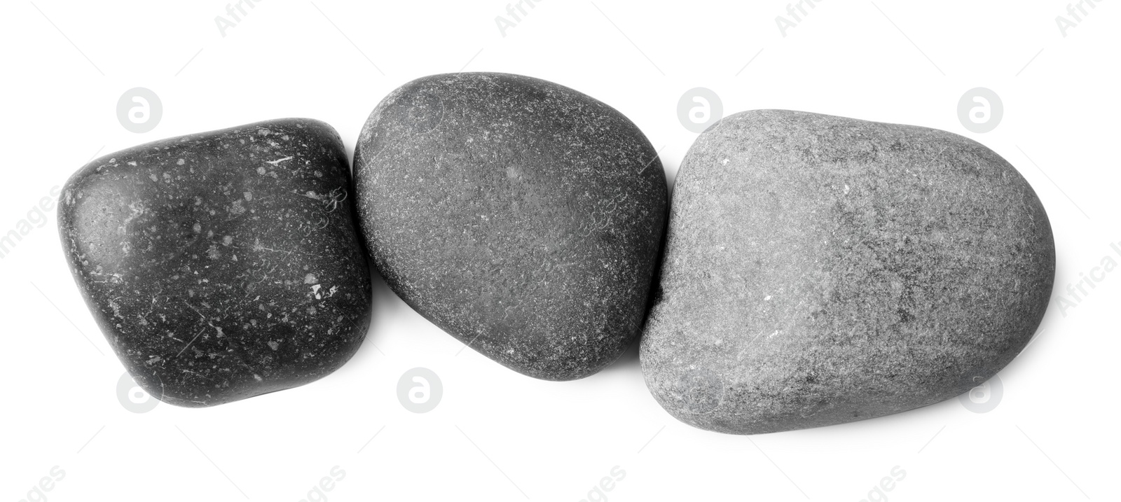 Photo of Group of different stones on white background, top view