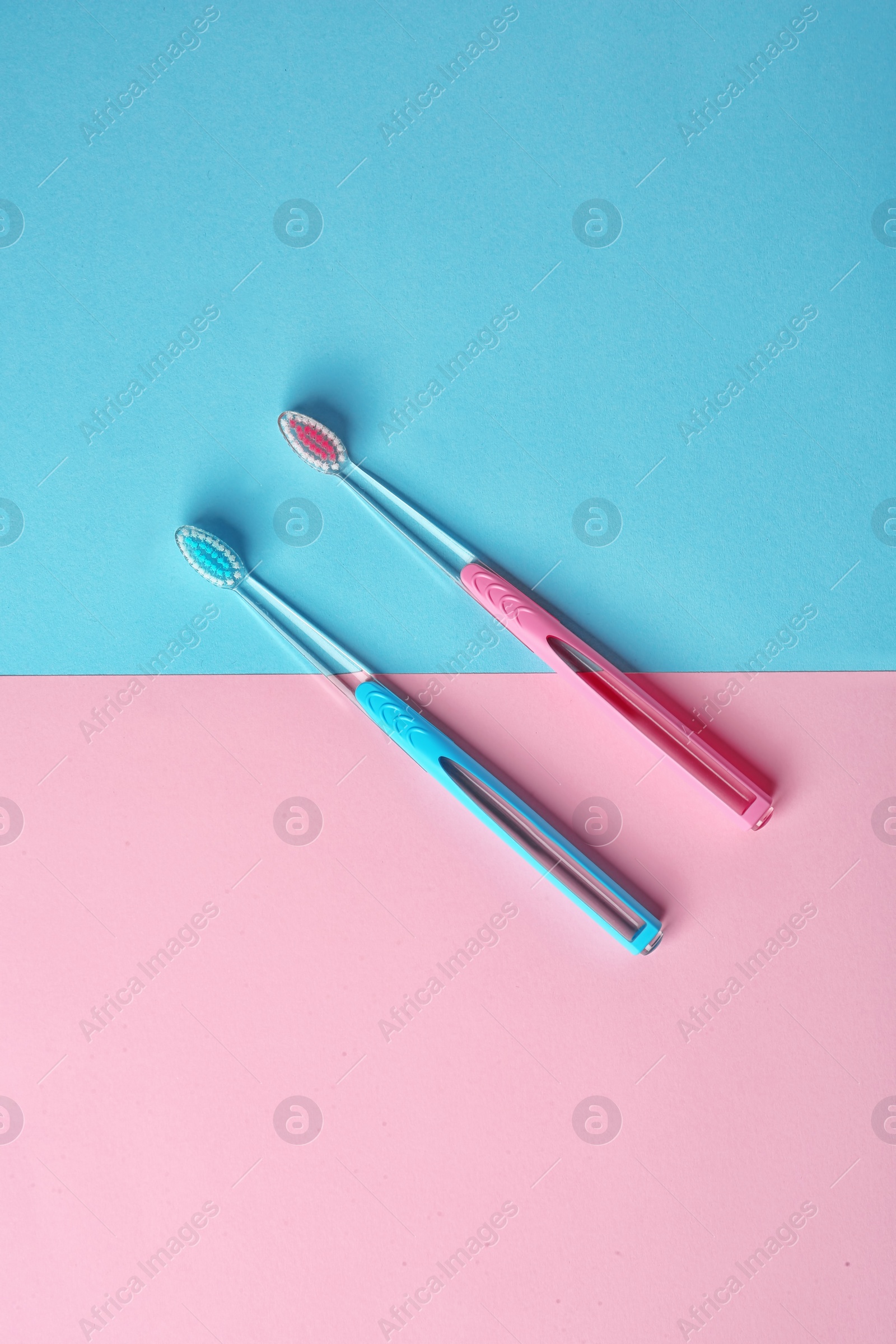 Photo of Manual toothbrushes on color background. Dental care