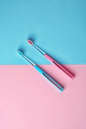 Photo of Manual toothbrushes on color background. Dental care