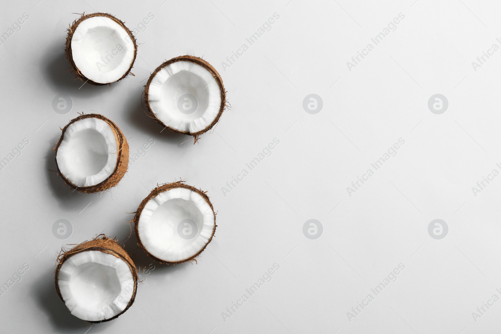 Photo of Composition with coconuts on white background, top view