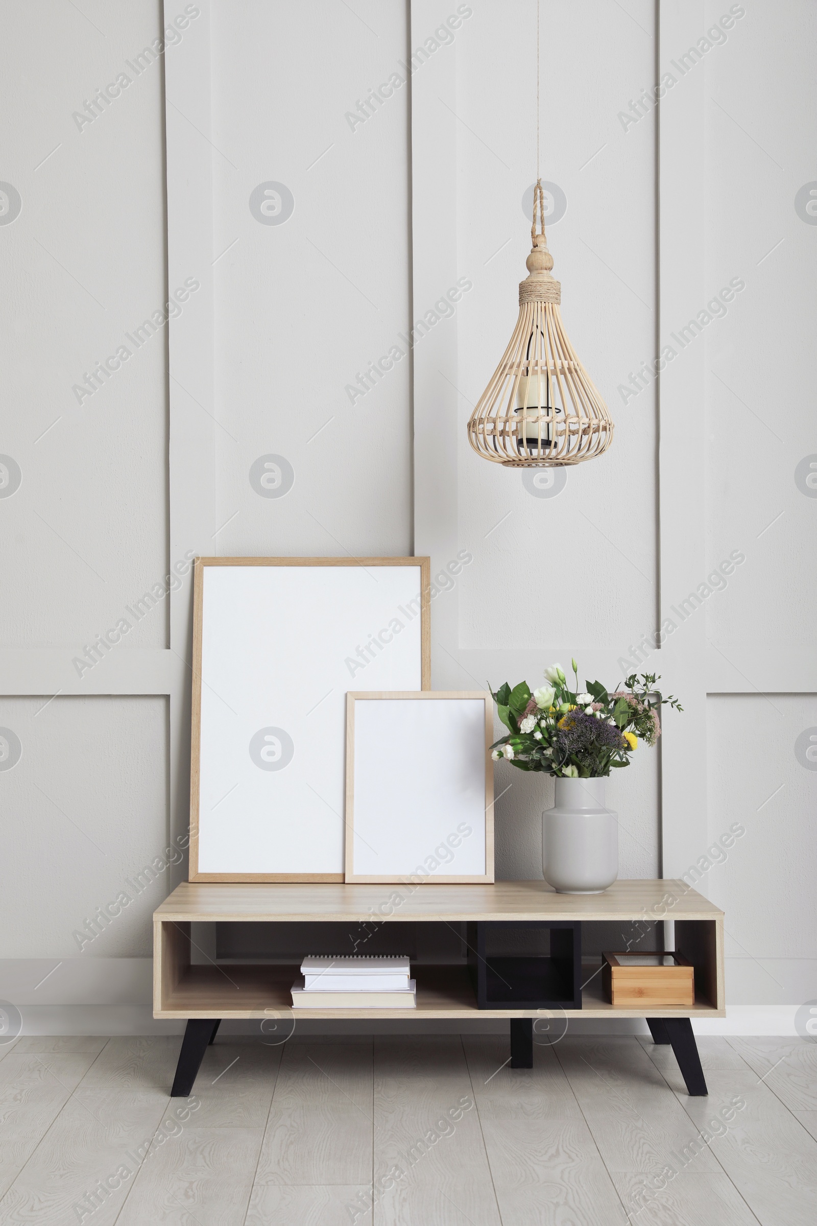 Photo of Simple room interior with console table and stylish decor elements