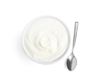 Photo of Tasty organic yogurt in bowl and spoon isolated on white, top view