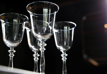 Photo of Empty clean glass on dark background, low angle view