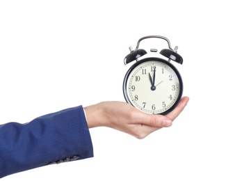 Young businesswoman holding clock on white background. Time management