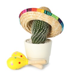 Cactus with Mexican sombrero hat and maracas isolated on white