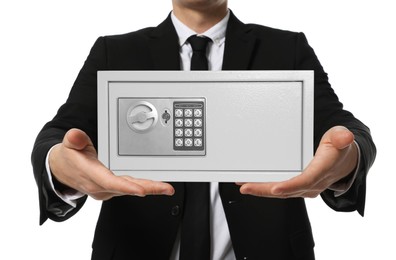 Image of Financial security, keeping money. Businessman holding steel safe on white background, closeup