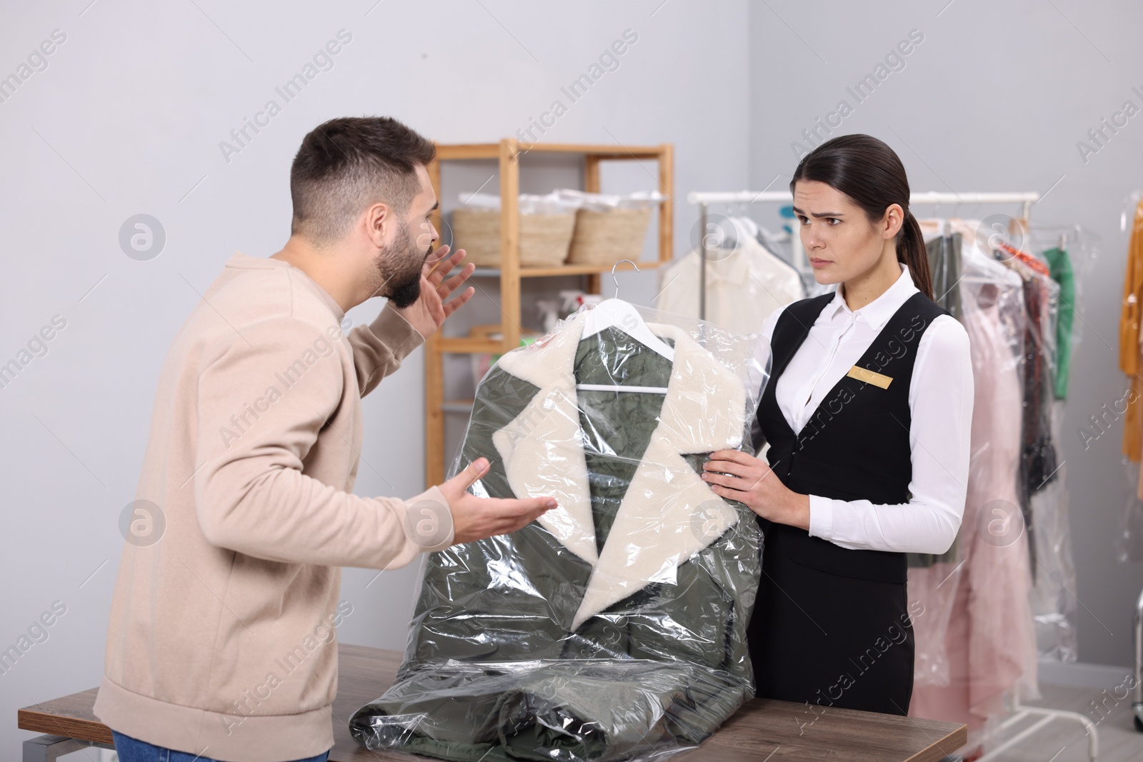 Photo of Client complaining about quality of service at dry cleaner's