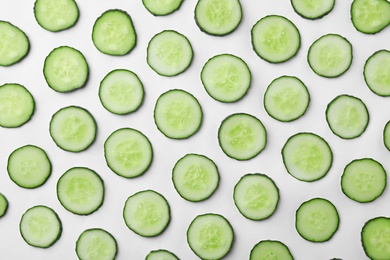 Photo of Flat lay composition with slices of cucumber on white background