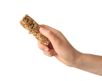 Woman holding grain cereal bar on white background. Healthy snack