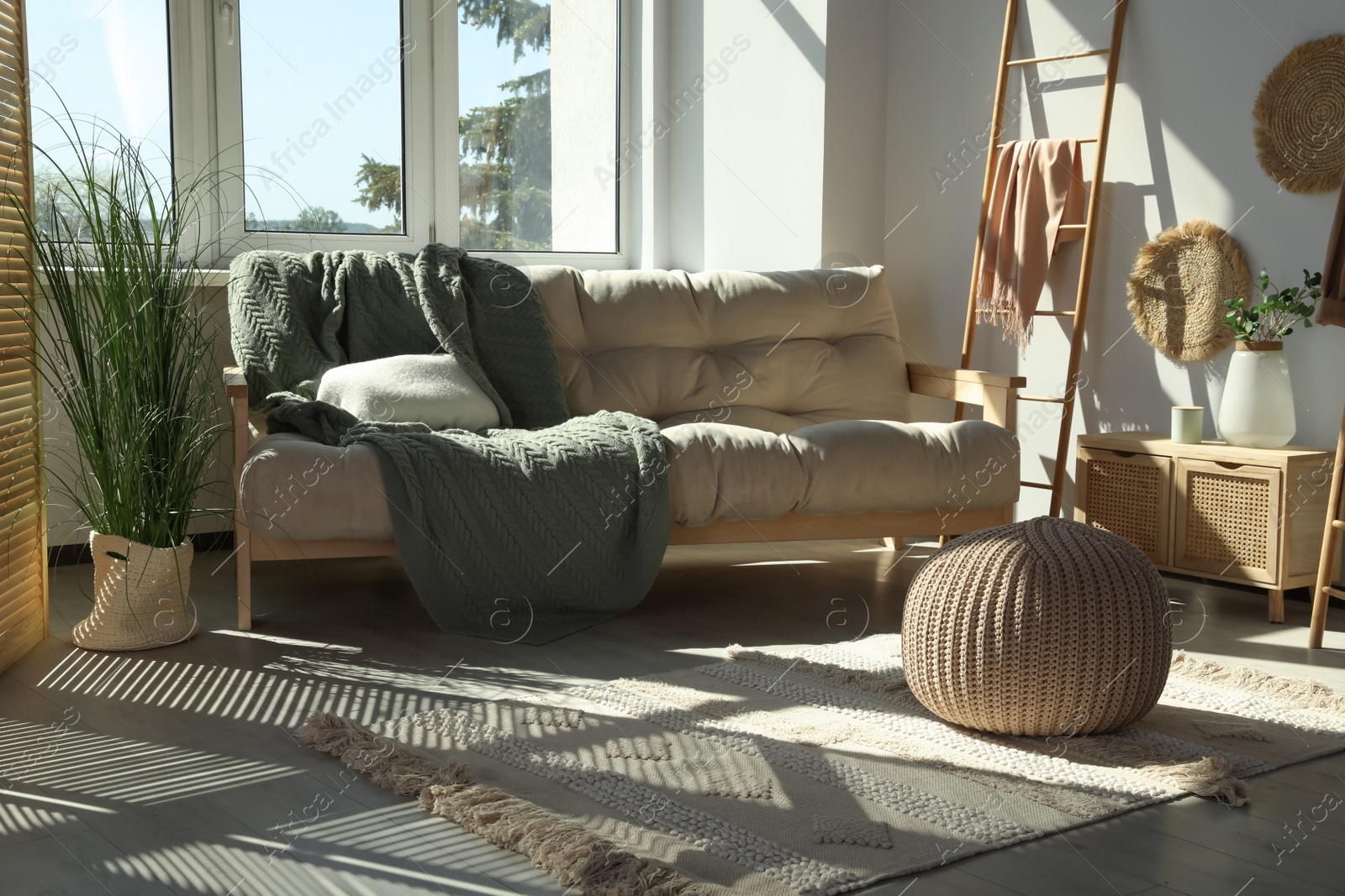 Photo of Beautiful room with big window and furniture. Stylish interior