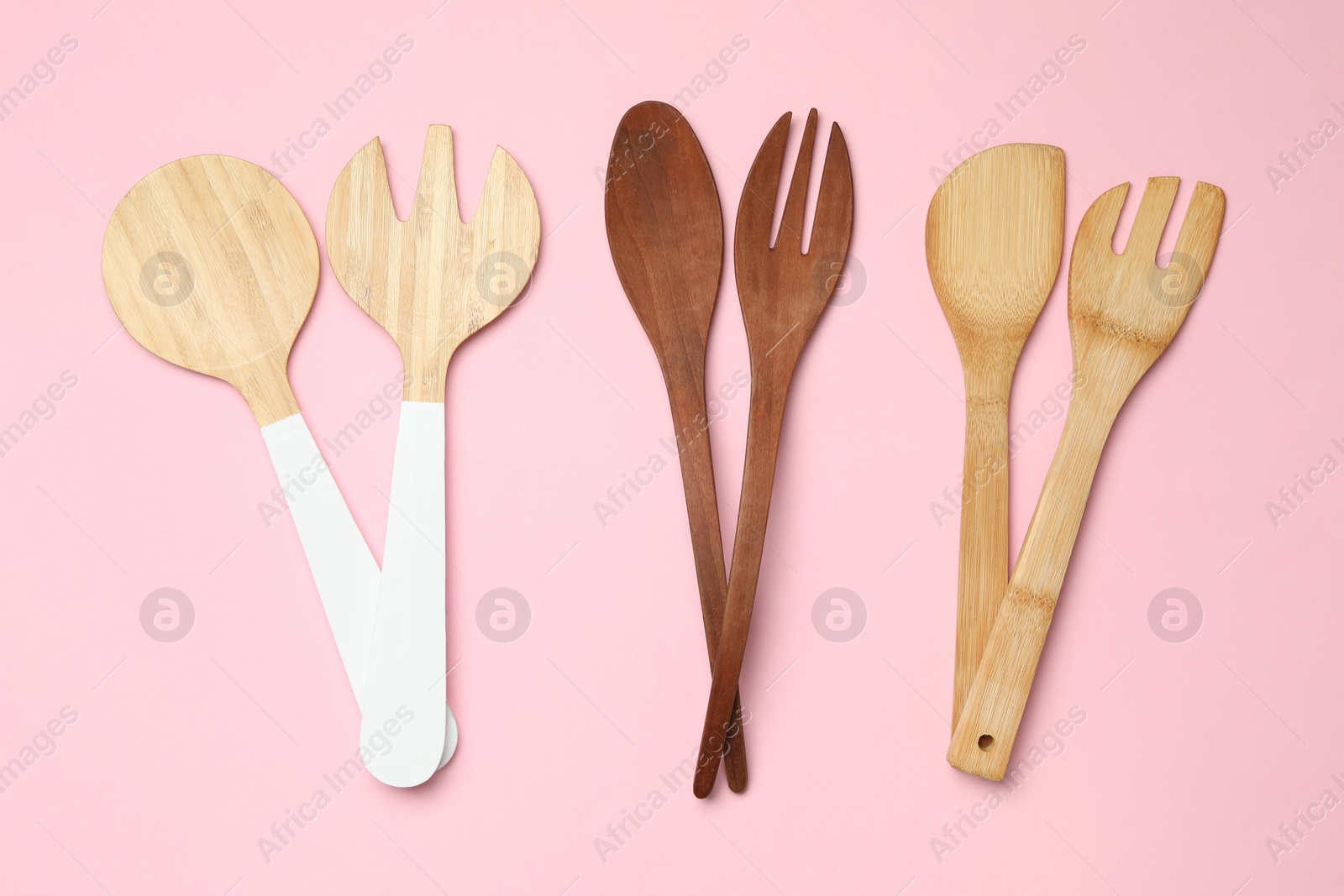Photo of Set of modern cooking utensils on pink background, flat lay
