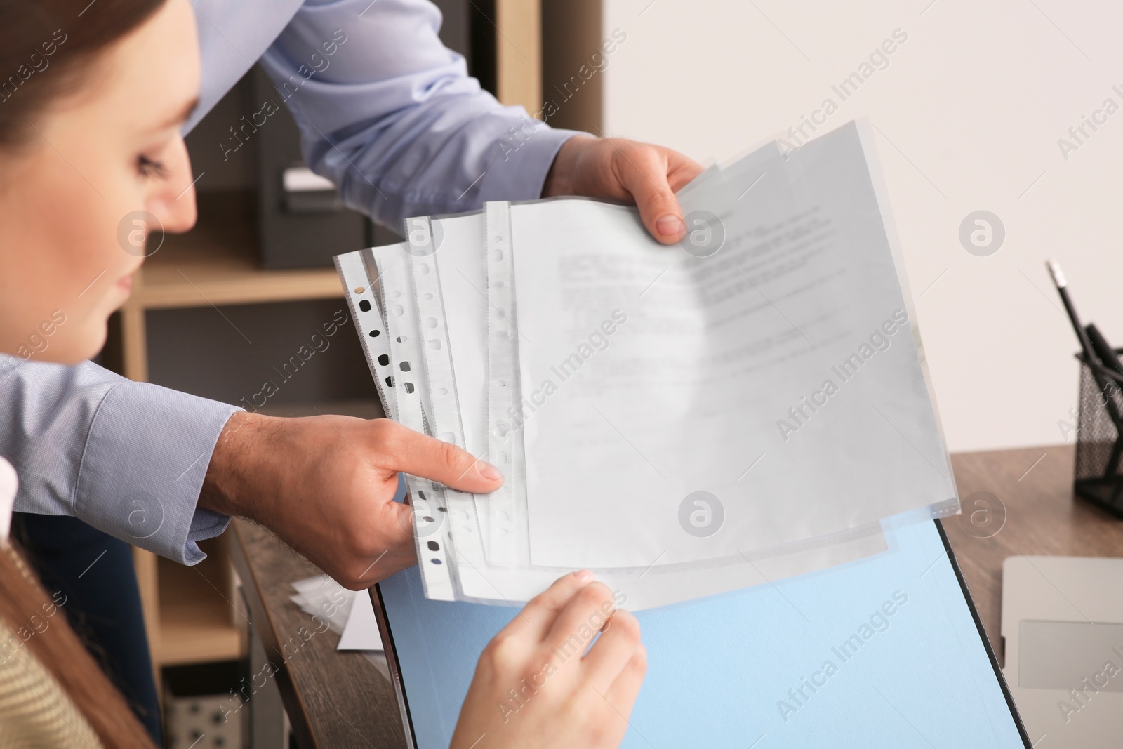 Photo of Businesspeople working with documents in office, closeup