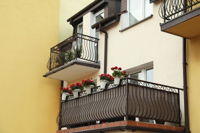 Stylish balconies decorated with beautiful potted plants