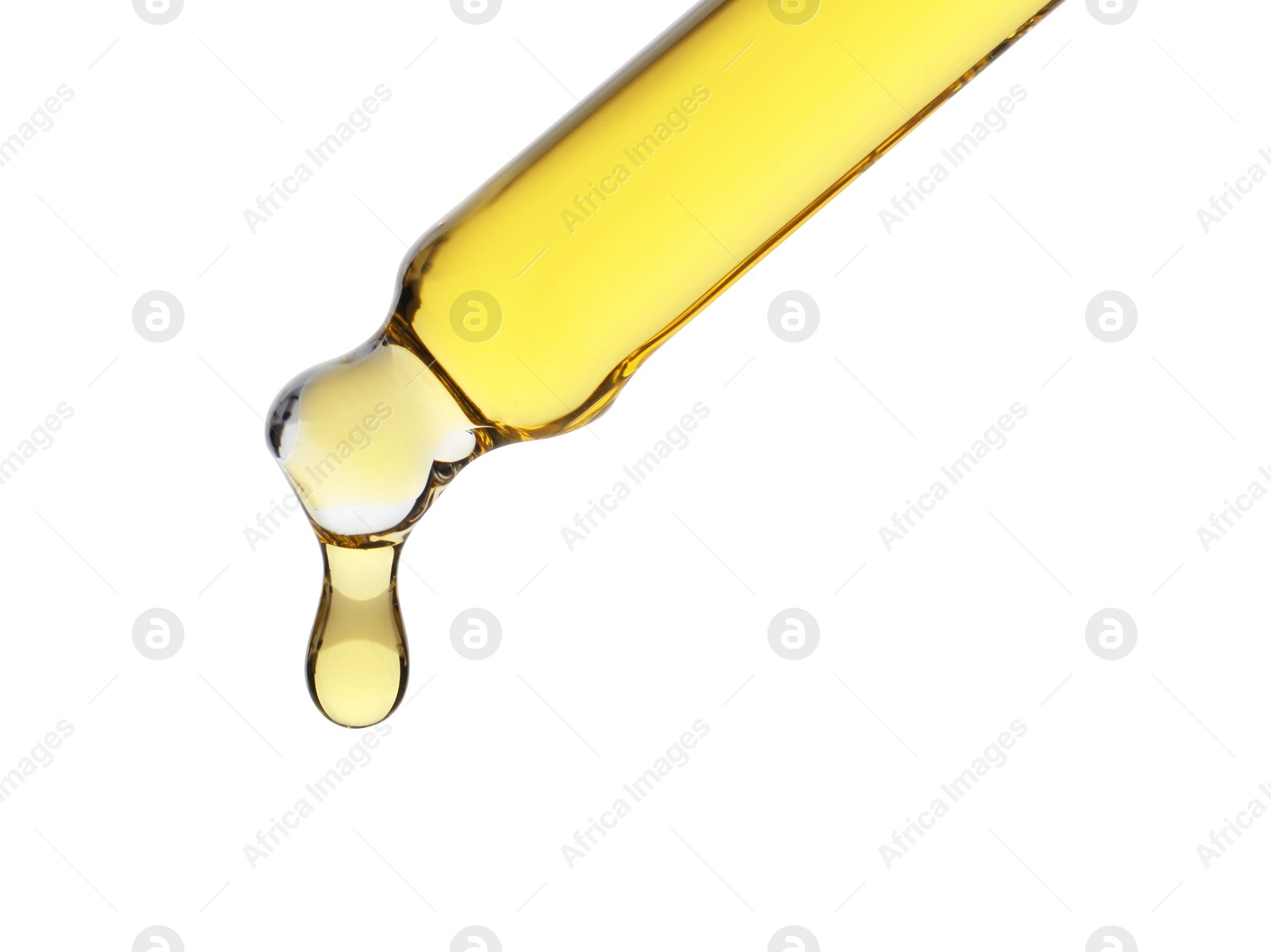 Photo of Dripping tincture from pipette isolated on white