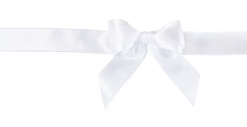 Photo of Satin ribbon with bow on white background, top view