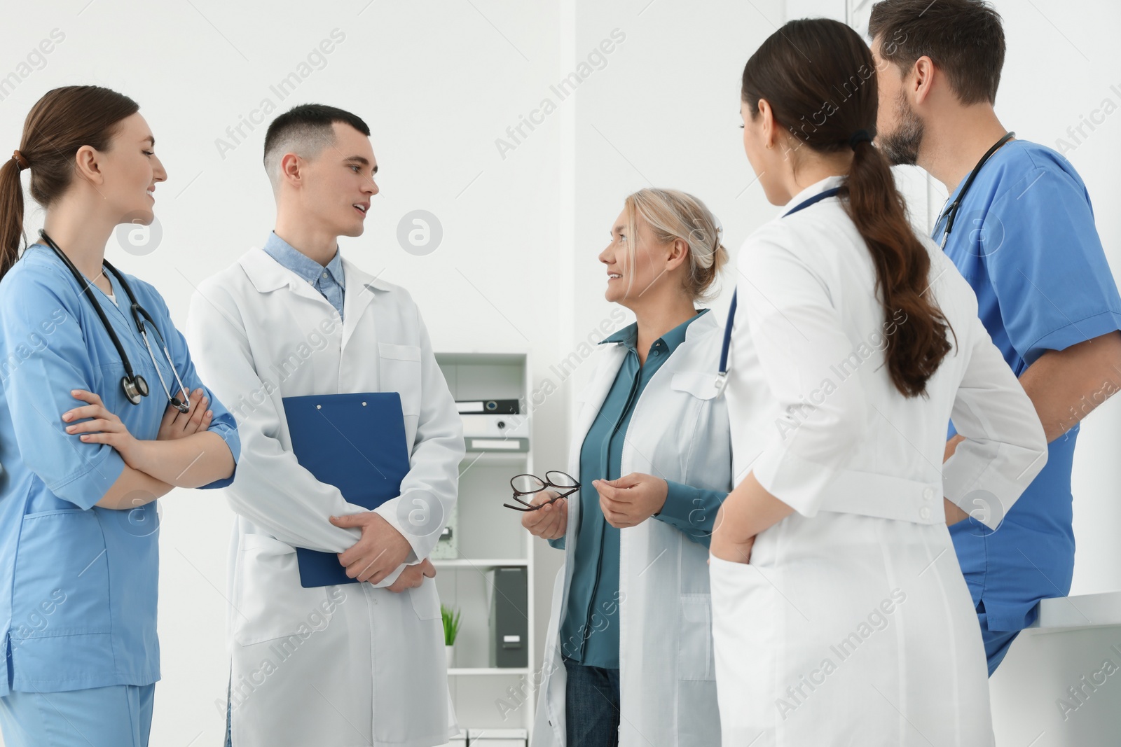 Photo of Team of doctors having discussion in clinic