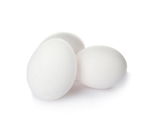 Photo of Few raw chicken eggs on white background