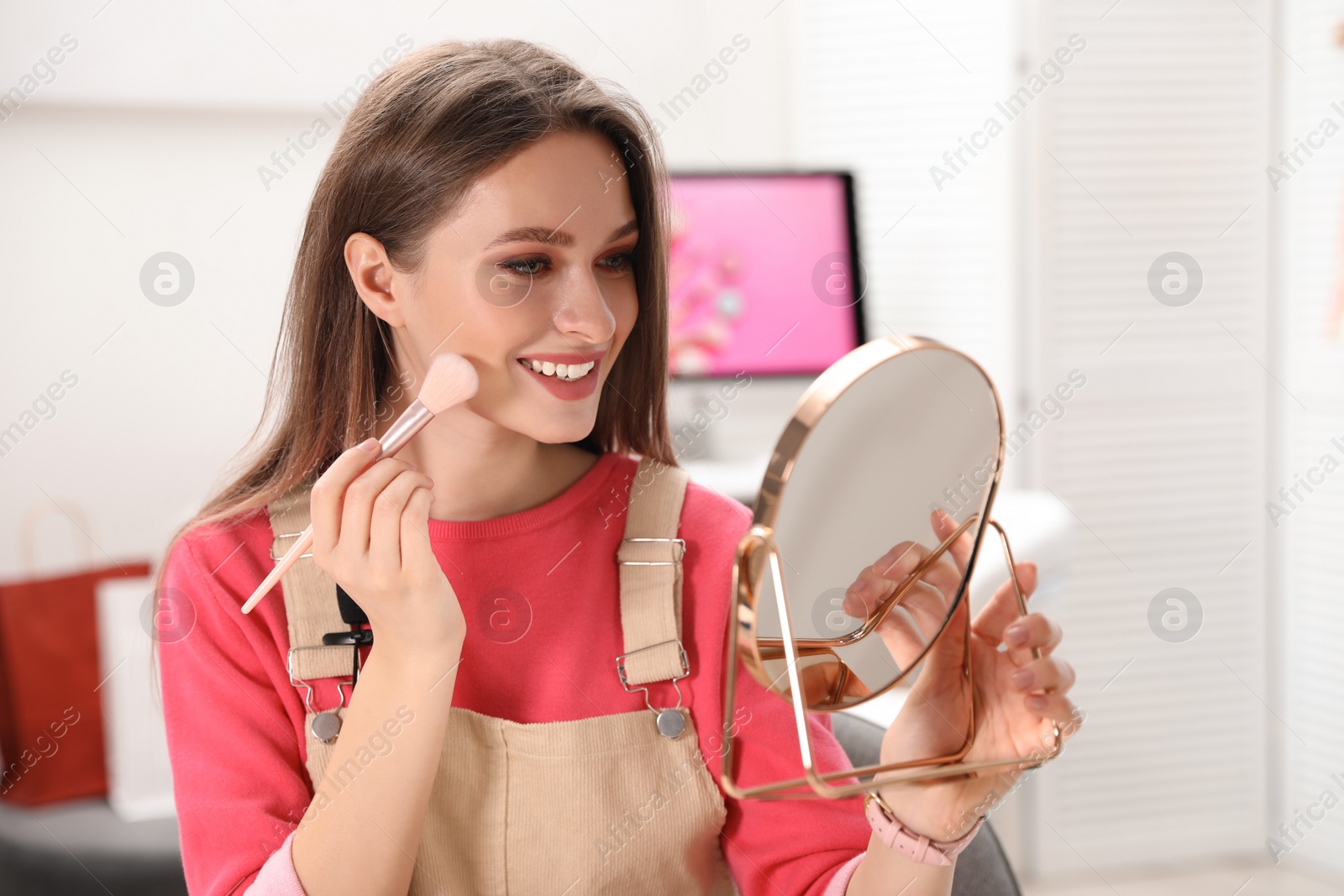 Photo of Beauty blogger doing make up at home