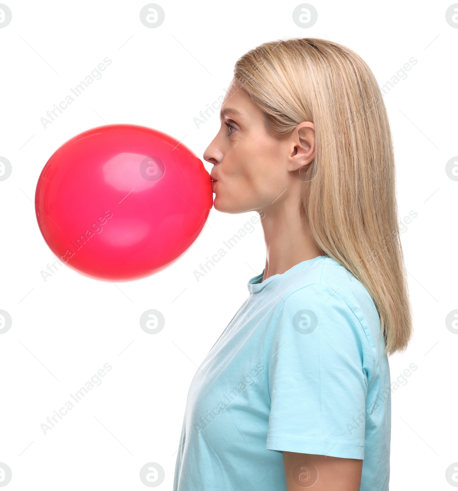 Photo of Woman blowing up balloon on white background