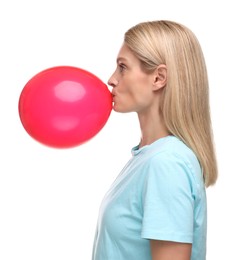 Woman blowing up balloon on white background