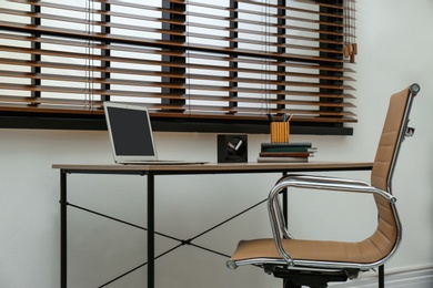 Stylish workplace interior with modern office chair