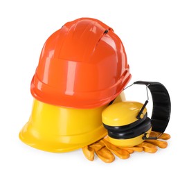 Photo of Hard hats, earmuffs and gloves isolated on white. Safety equipment