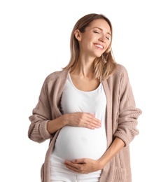 Happy pregnant woman touching her belly on white background