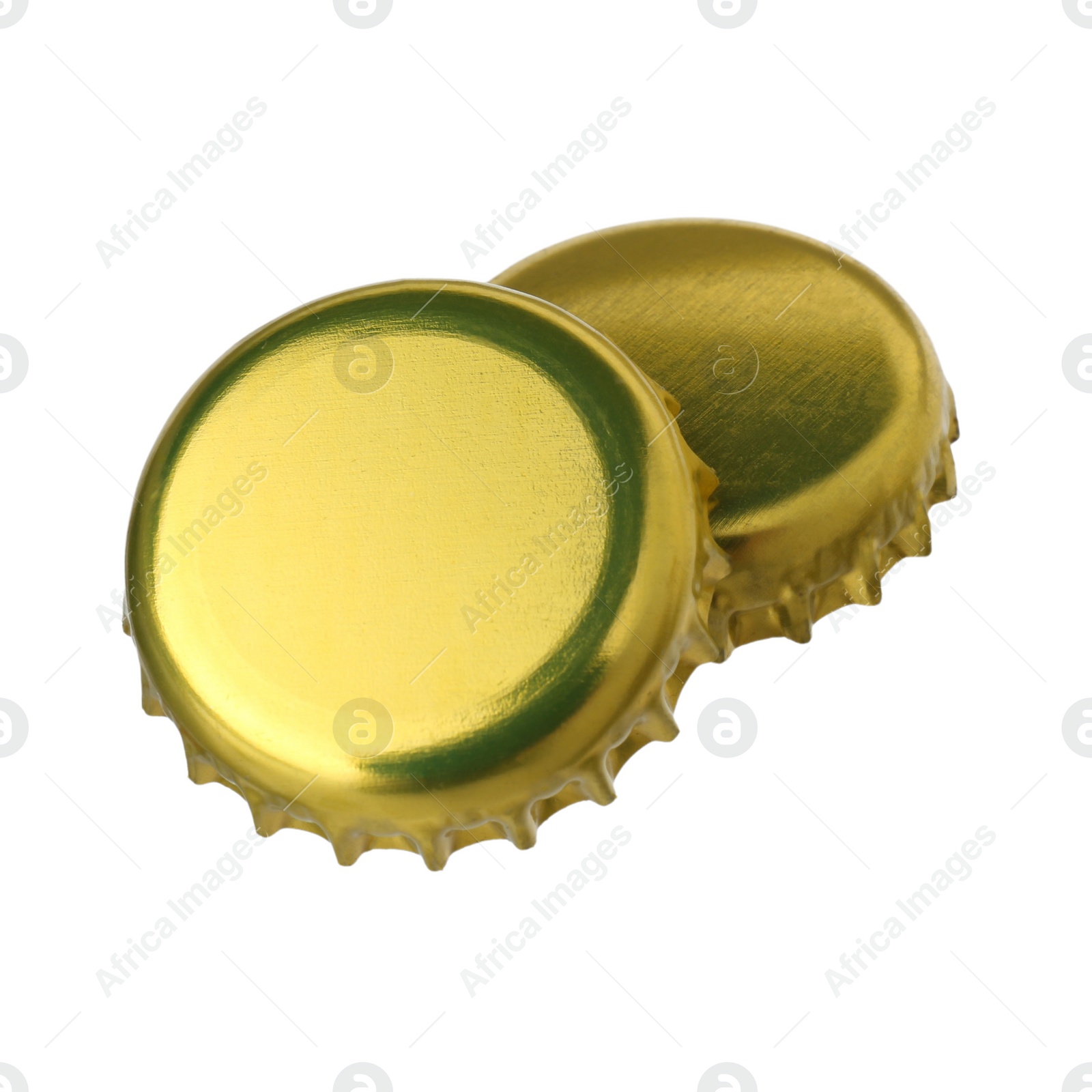 Photo of Two golden beer bottle caps isolated on white
