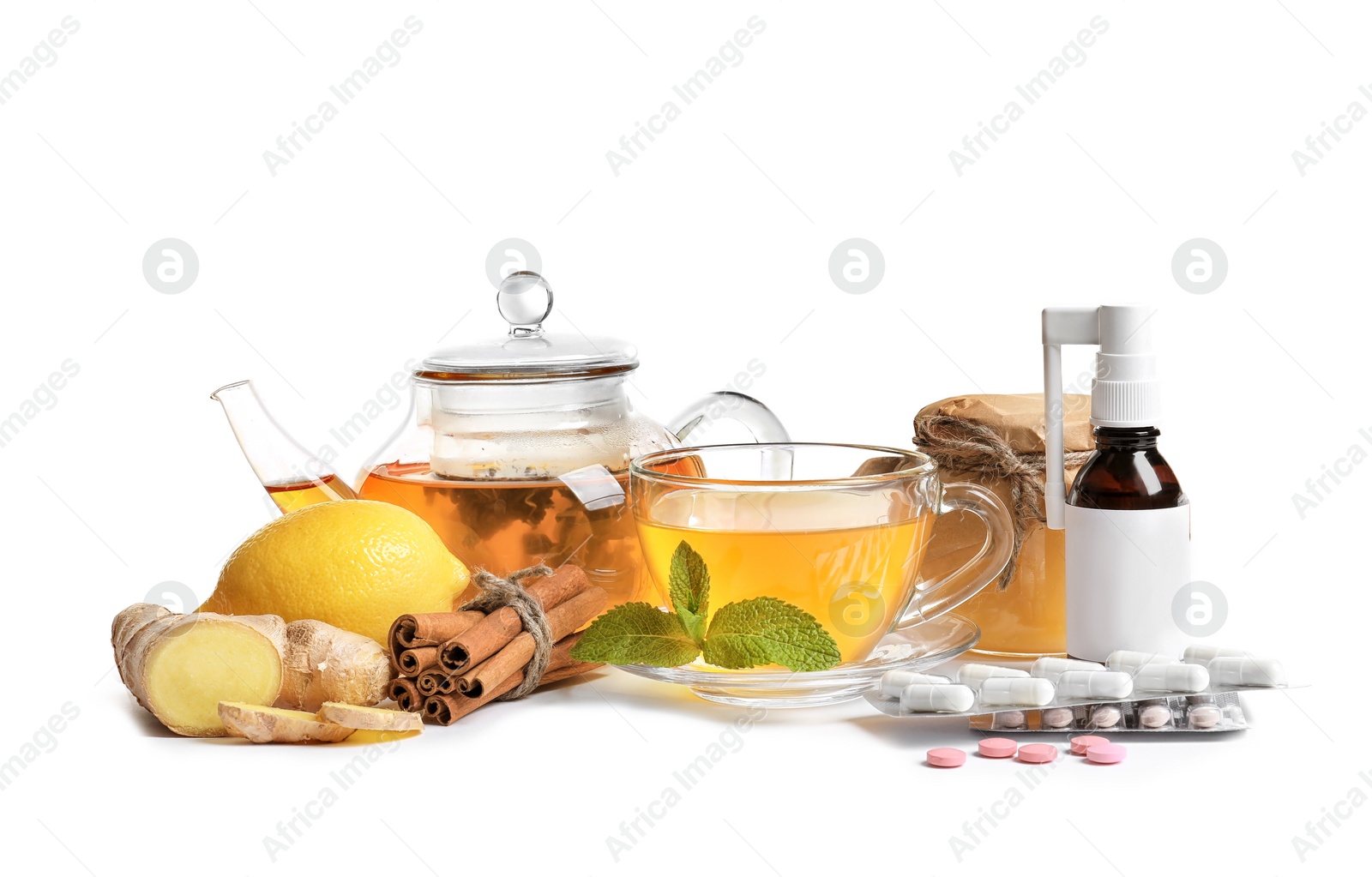 Photo of Natural and medical cold remedies on white background