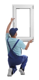 Worker with plastic window on white background, back view. Installation service