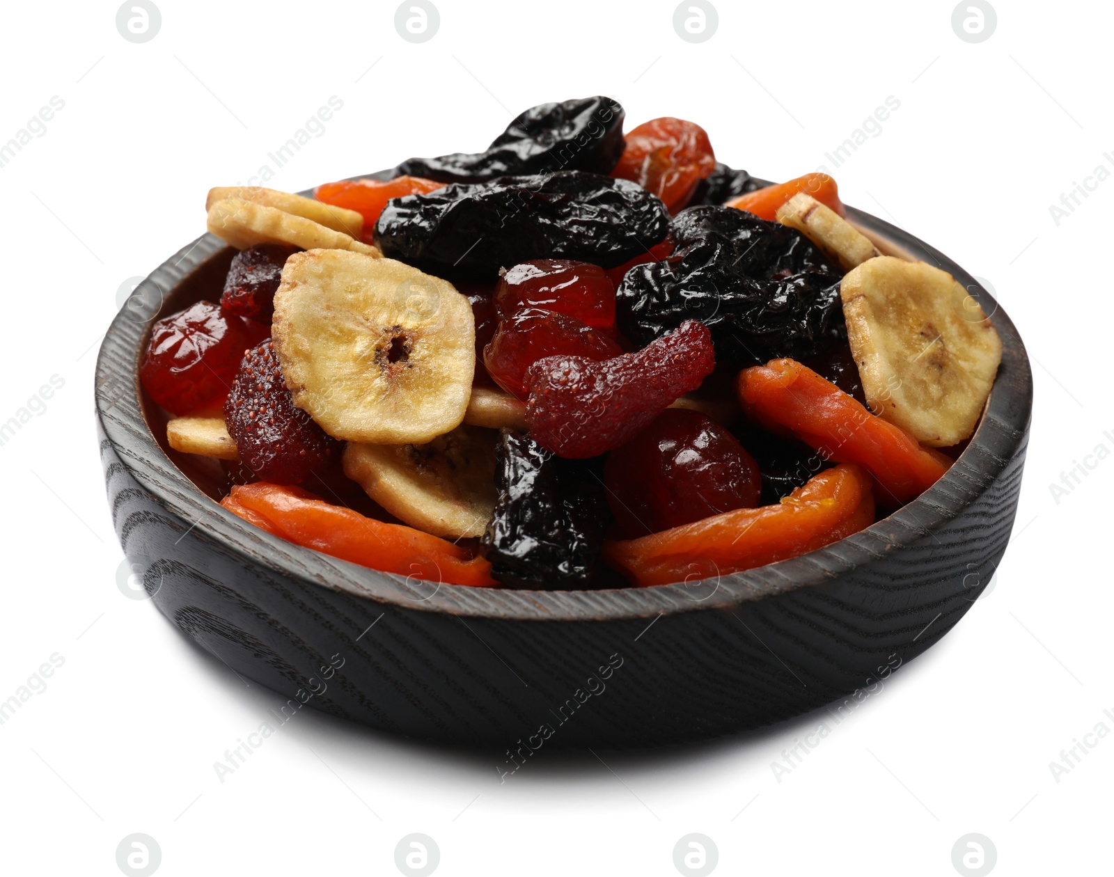 Photo of Mix of delicious dried fruits in wooden bowl isolated on white