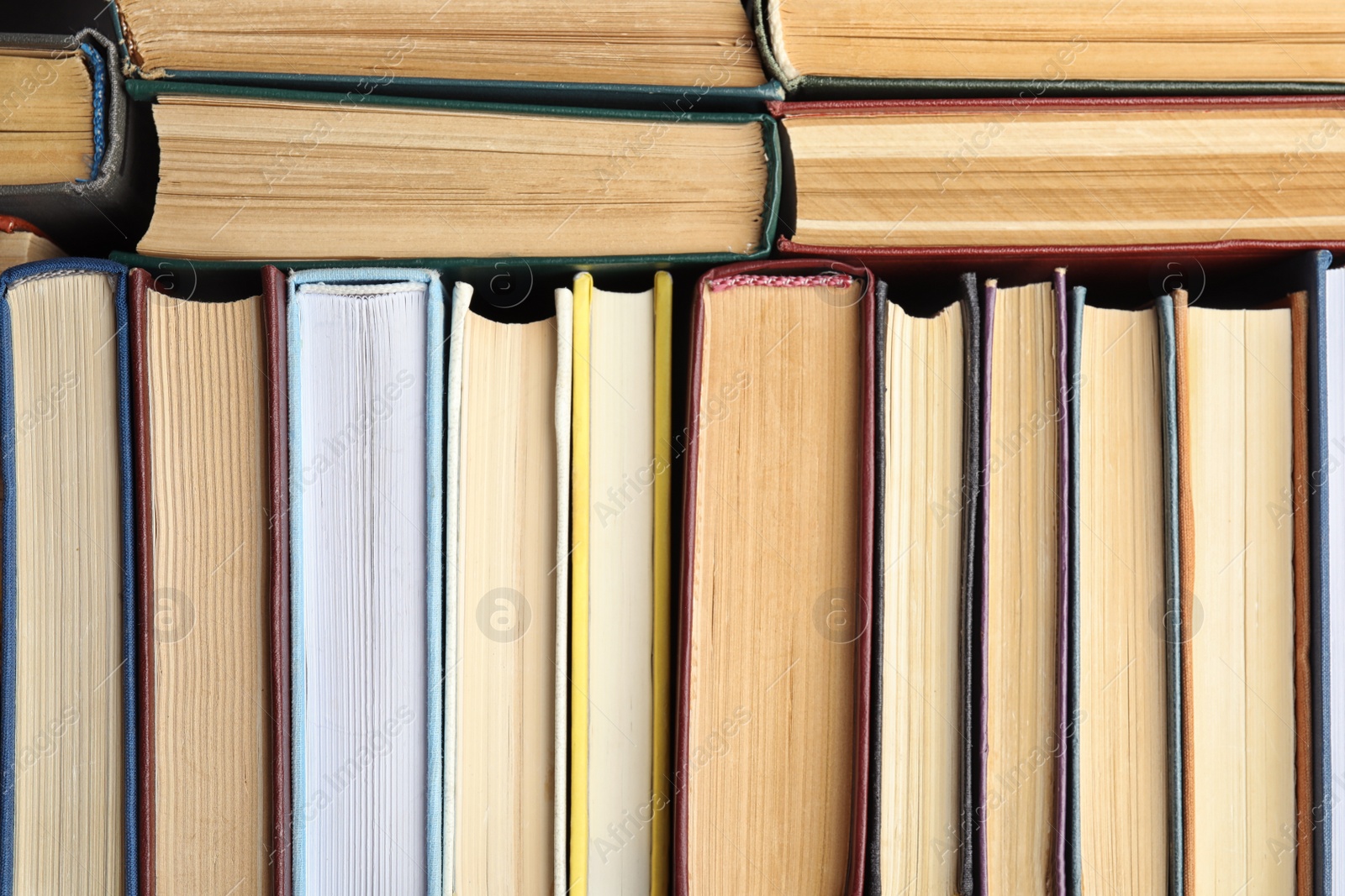 Photo of Many different hardcover books as background, top view