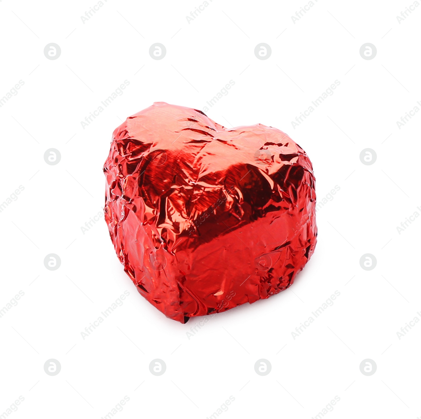 Photo of Heart shaped chocolate candy in red foil on white background