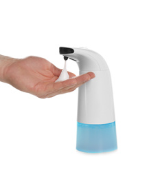 Photo of Man using automatic soap dispenser on white background, closeup