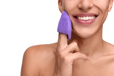 Photo of Happy young man washing his face with sponge on white background, closeup