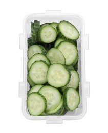Photo of Plastic container with fresh cut cucumbers isolated on white, top view