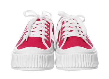 Pair of red classic old school sneakers on white background