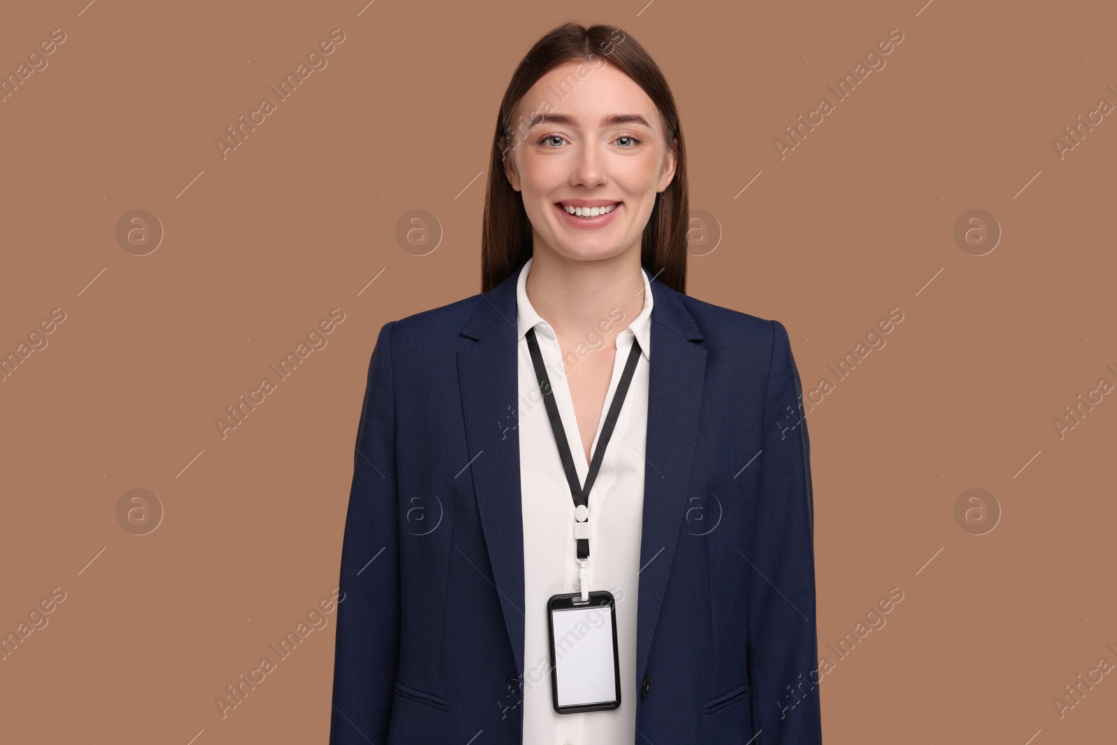 Photo of Woman with blank badge on light brown background