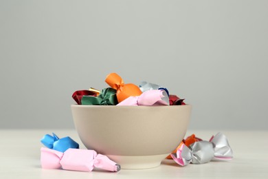 Candies in colorful wrappers on light table