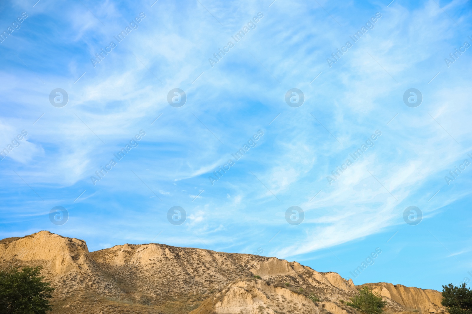 Photo of Beautiful blue sky and hill on cloudy day